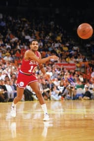 Maurice Cheeks passes the ball