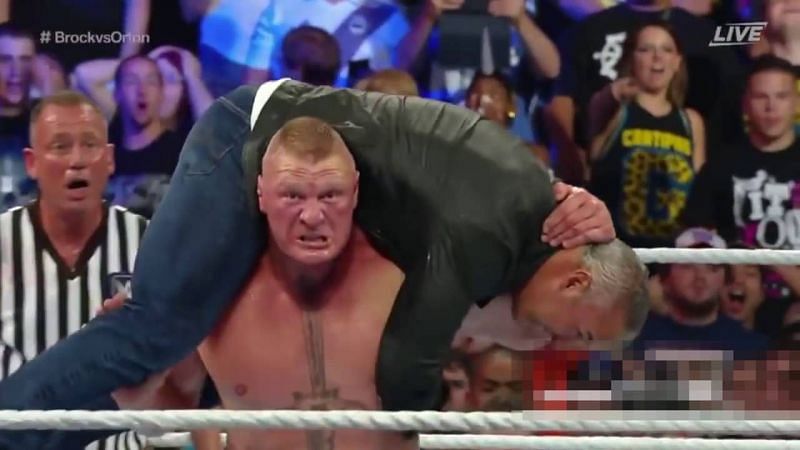 Brock Lesnar delivering an F5 to Shane McMahon