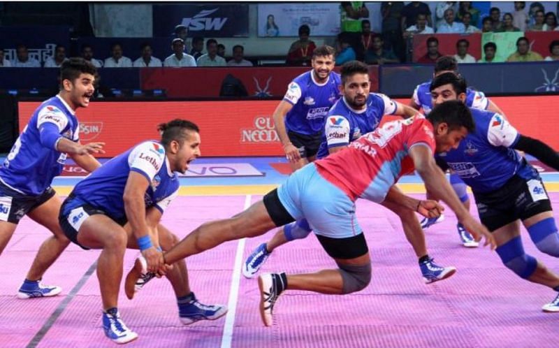 Vikas executing an ankle hold over Panthers&#039; Ajit Singh.
