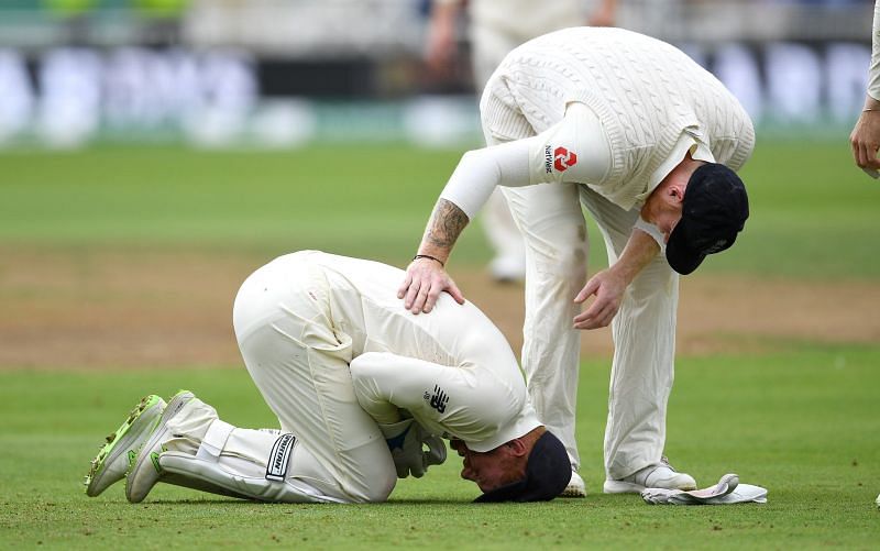 Bairstow kneeling in pain as teammates rush in to help
