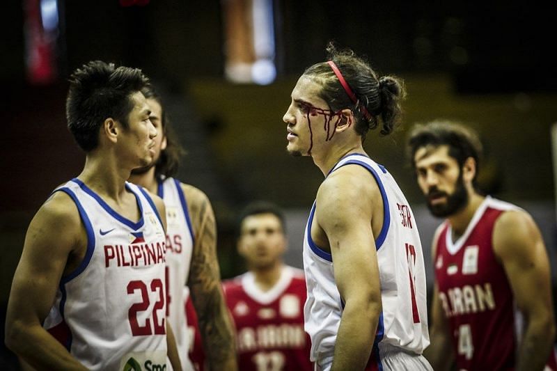 Blodied but not out of it. Marcio Lassiter tries to bounce back in their game against Qatar.