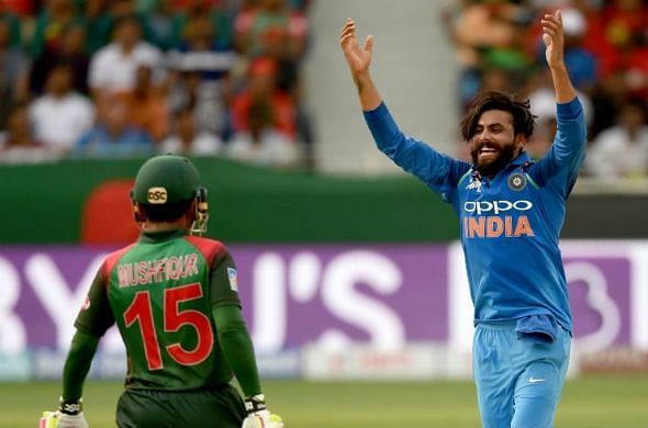 Ravindra Jadeja is celebrating after taking Mushfiqur&#039;s wicket