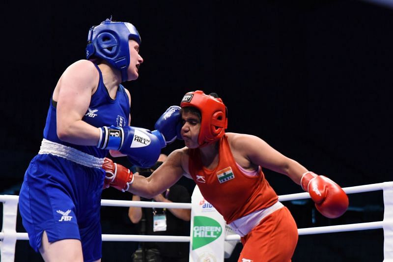 Manisha of India in Red takes a blow from Gemma Paige of England (Image Courtesy: AIBA)