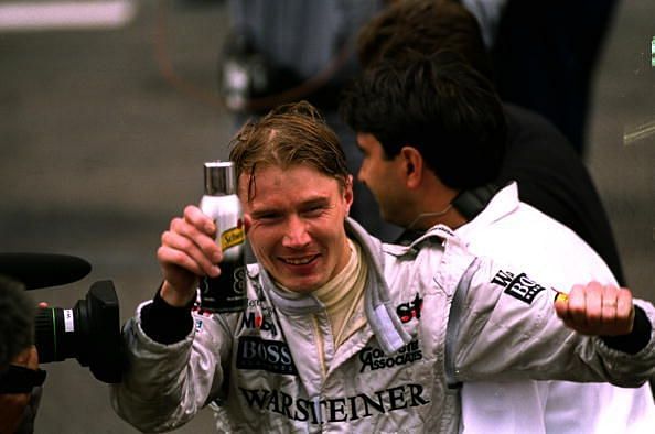 Mika hakkinen of Finland and McLaren-Mercedes celebrates his victroy