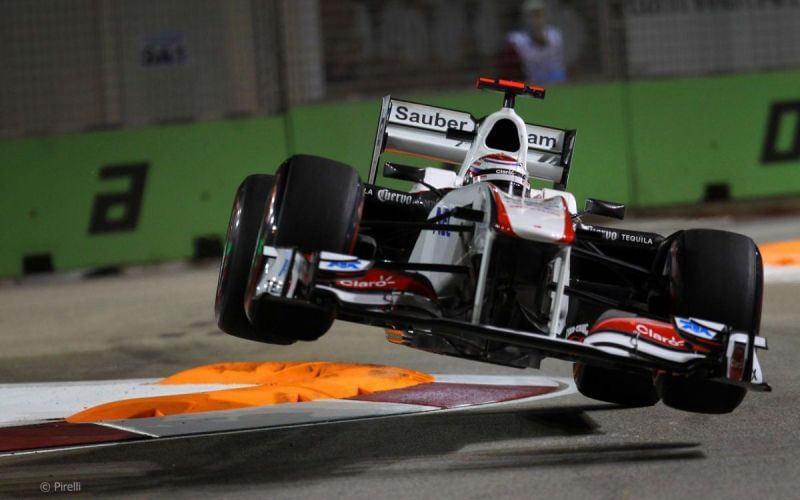 Kamui Kobayashi going airborne at Singapore Sling chicane in his Sauber