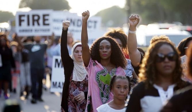 Police shooting protesters march outside Cowboys' stadium