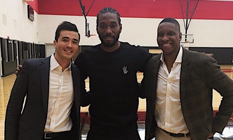 Kawhi Leonard (center) with President of Basketball Operations for the Raptors - Masai Ujiri (right)