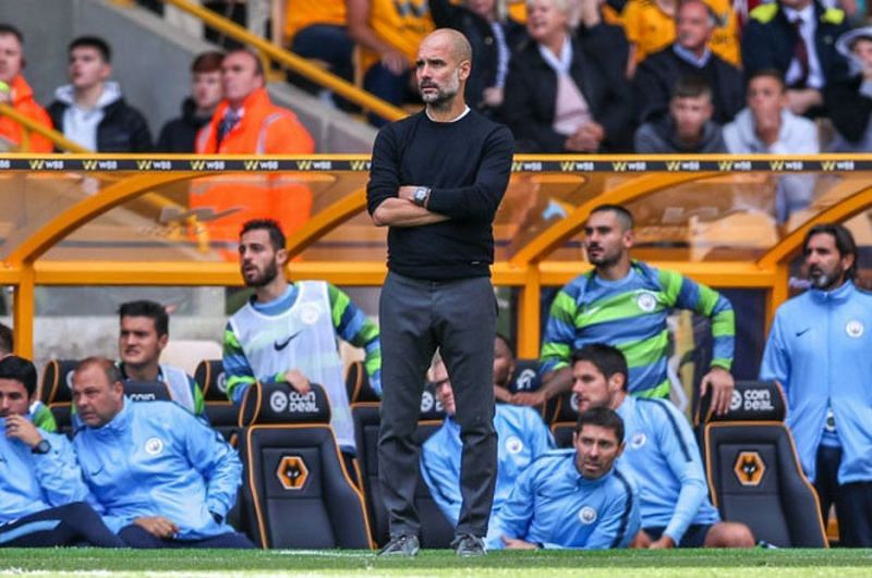 Pep Guardiola looking on at Molineux