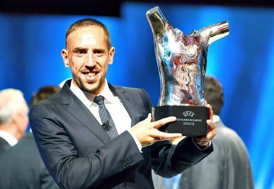 The Frenchman poses as the UEFA Player of the Year.