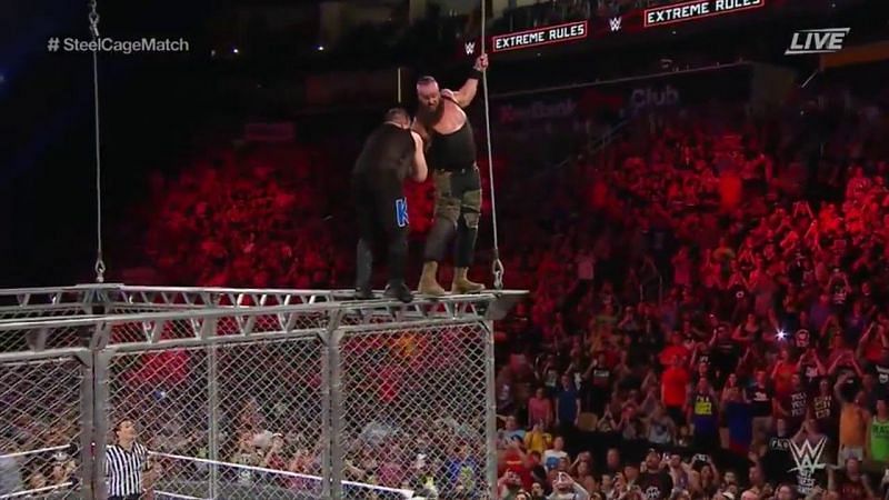 Image result for braun strowman throws kevin owens off a steel cage