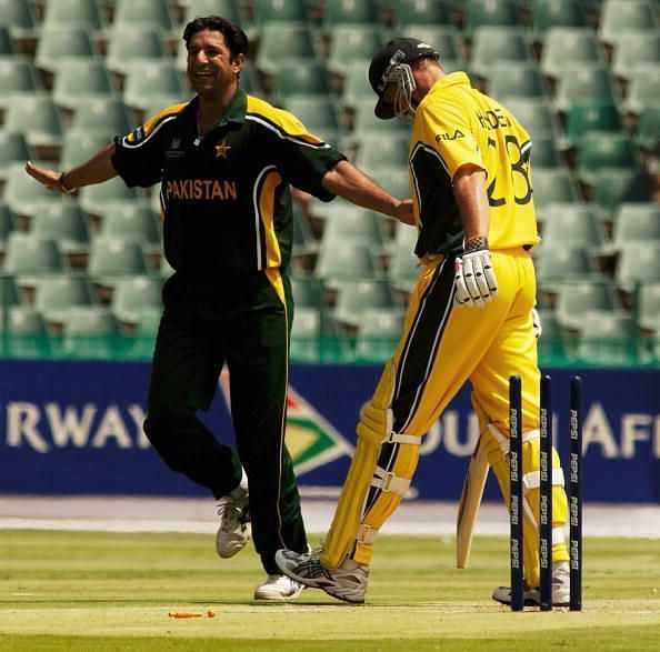 Wasim Akram of Pakistan celebrates the wicket of Matthew Hayden of Australia