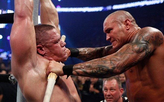 Randy Orton choked Cena with the Kendo Stick