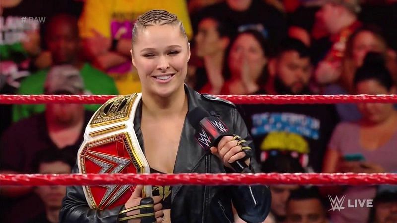 Ronda Rousey with the RAW Women&#039;s Championship on her shoulder