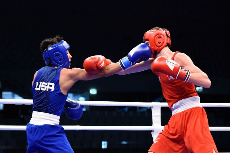 Asa Stevens of USA in Blue in action against Ivan Price of England (Image Courtesy: AIBA)