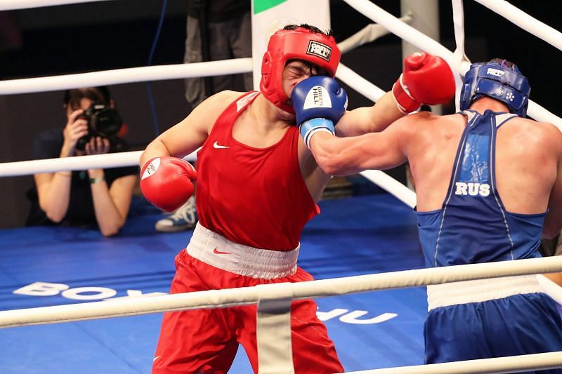Fedorov of Russia in Blue caught Aibek of Kazakhstan with a Left hook (Image Courtesy: AIBA)