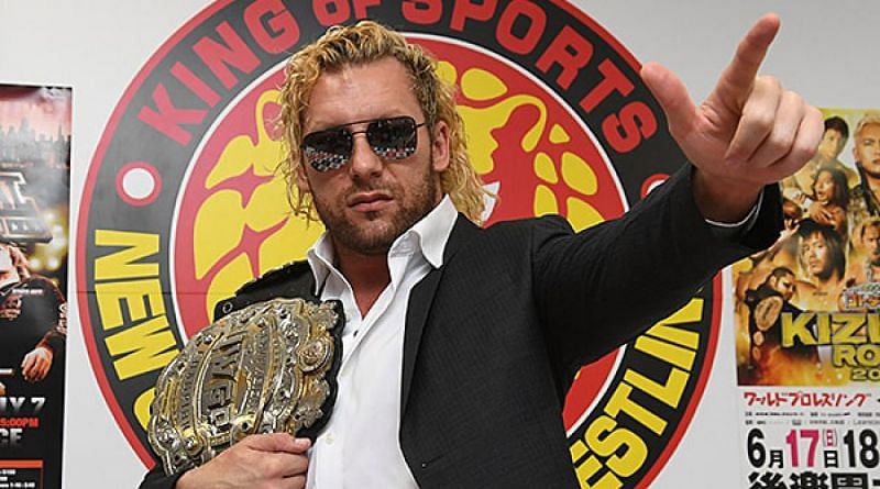 Kenny Omega with the IWGP Heavyweight Title