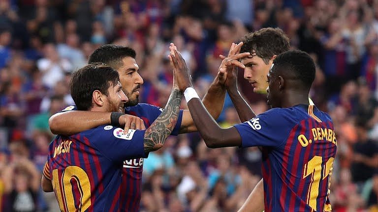 Barcelona thrash Huesca to take pole position in the league