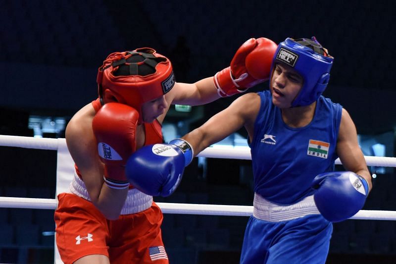 Destiny Garcia of USA in Red produces a big Left Hook against Anamika of India (Image Courtesy: AIBA)