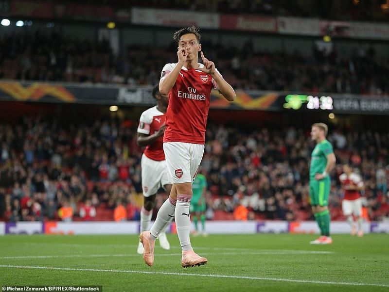 Ozil celebrates his goal