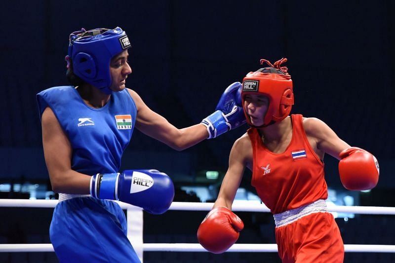 Nitu of India in Blue unleashes a Left Hook on Meekoon of Thailand (Image Courtesy: AIBA)