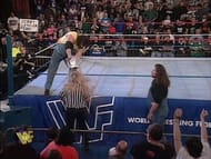 The Godwinns pour a bucket of slime over the referee's head.
