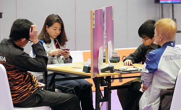 A vertical board stops a pair from communicating with each other. 