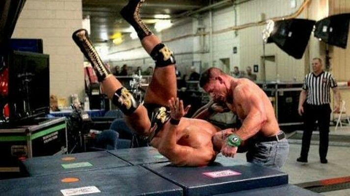 John Cena and Alberto Del Rio fighting backstage