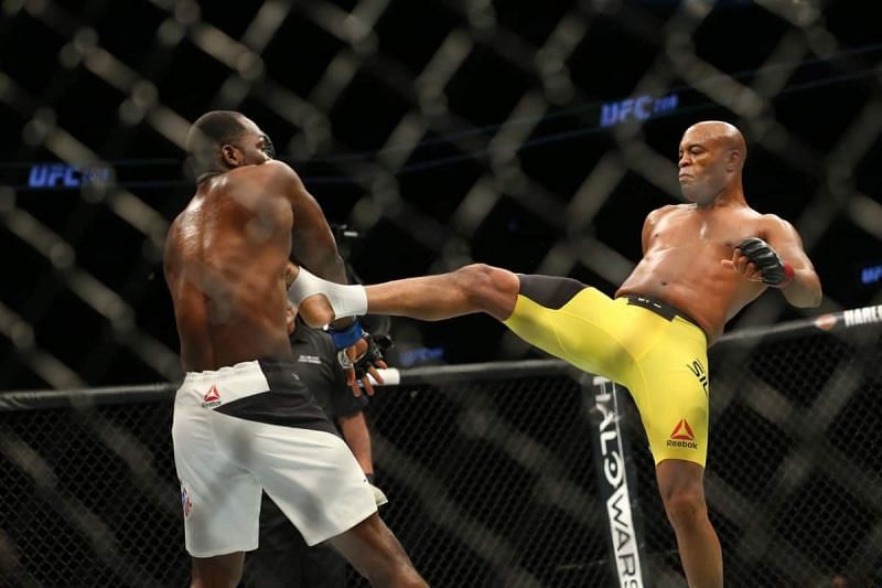 Anderson Silva (right) landing a front kick to the body of Derek Brunson (left) in their last fight