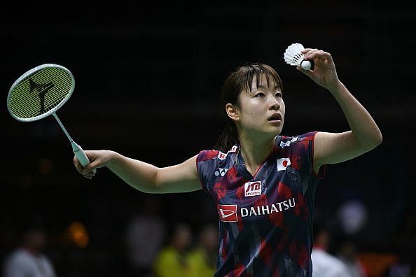 Nozomi Okuhara serving during Thomas and Uber cup finals 2018.