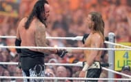 Michaels and the Undertaker shake hands after their 2nd Wrestlemania classic in a row