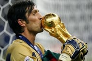 Buffon kisses the FIFA World Cup Trophy after Italy's win in 2006. (Image: Vox)
