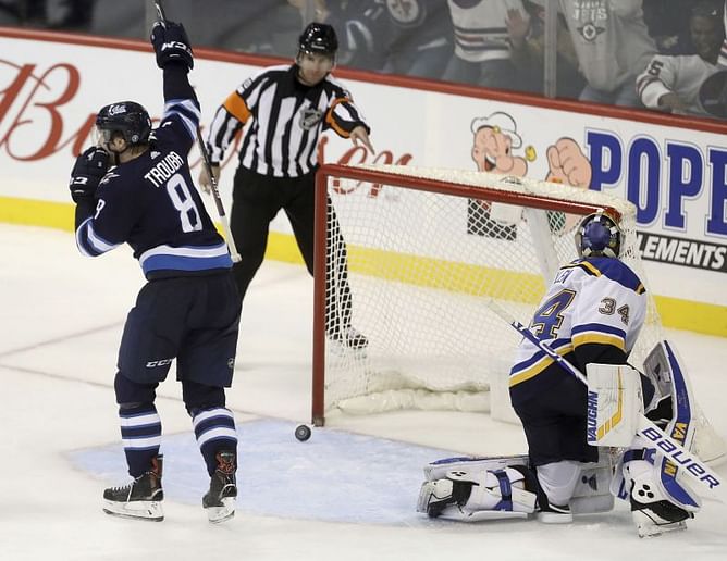 Trouba scores in OT to lift Jets over Blues 5-4