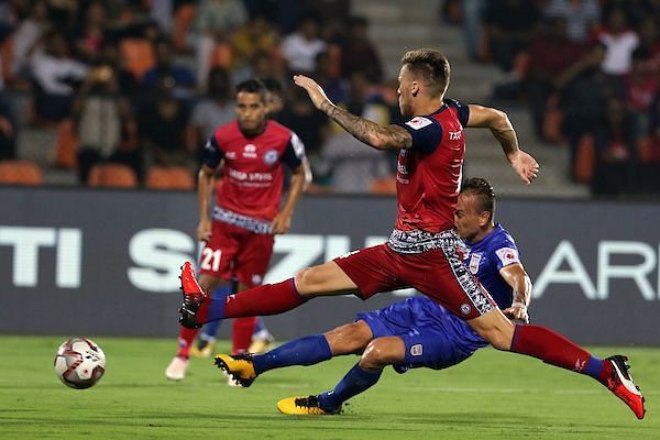 Lucian Goian&#039;s shot gets blocked by a Jamshedpur defender