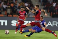 Lucian Goian's shot gets blocked by a Jamshedpur defender