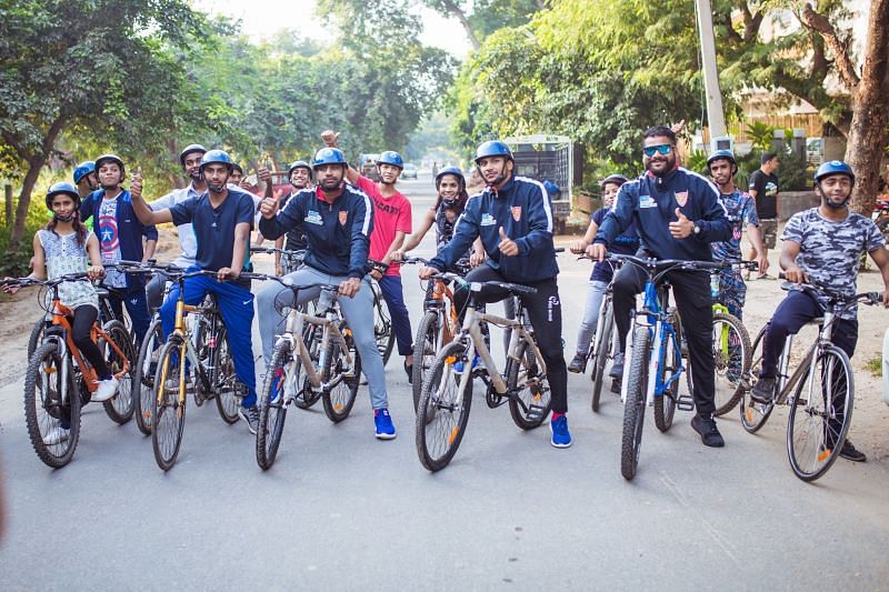Dabang Delhi Kabaddi Club Players Cycling with NGO Kids