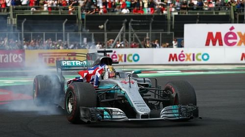 Lewis Hamilton celebrates winning the F1 title in Mexico in 2017