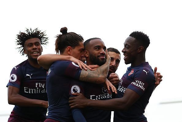 Lacazette celebrates with teammates after scoring against Fulham