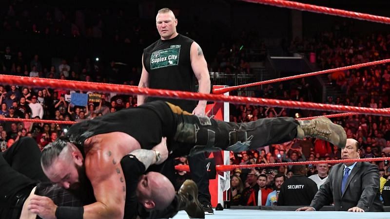 Strowman attacks Baron Corbin as Lesnar looks on