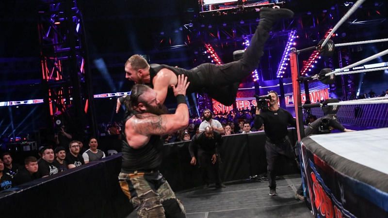 Dean hits Braun with a suicide dive