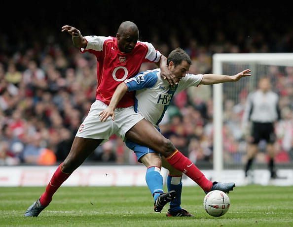 Patrick Vieira of Arsenal battles with David Thompson of Blackburn