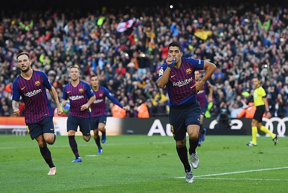 Suarez wheels away to celebrate one of his three goals against Real during a memorable El Clasico