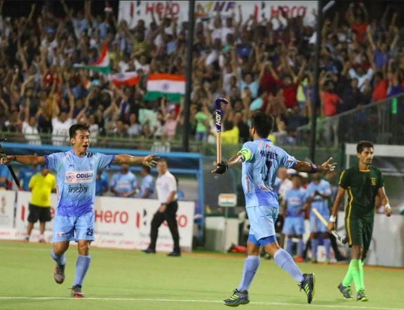 Manpreet Singh celebrates his goal with Chinglensana Singh