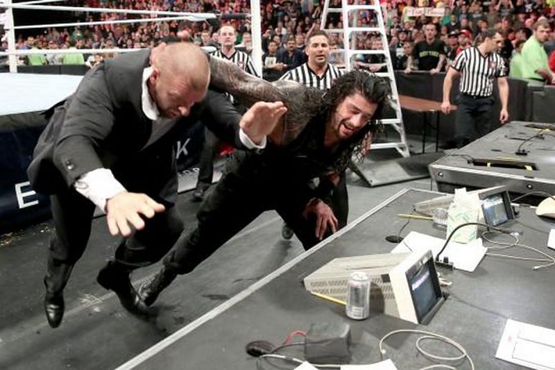 Roman Reigns attacks Triple H