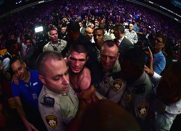 Khabib is restrained by security in the incredible aftermath of UFC 229