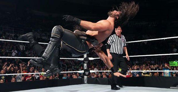 Roman Reigns spears Seth Rollins
