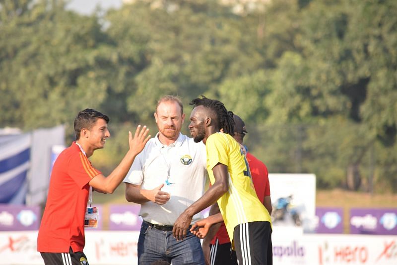 Real Kashmir&#039;s Gnohere Krizo (right) with coach David Robertson (centre) after the I-League game against Minerva Punjab