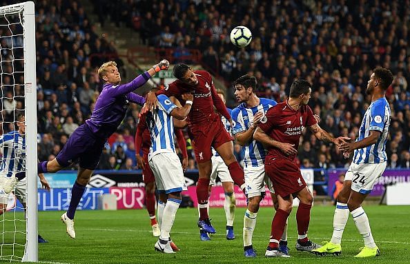 Huddersfield suffer their sixth loss of the season in a tightly fought battle against Liverpool.