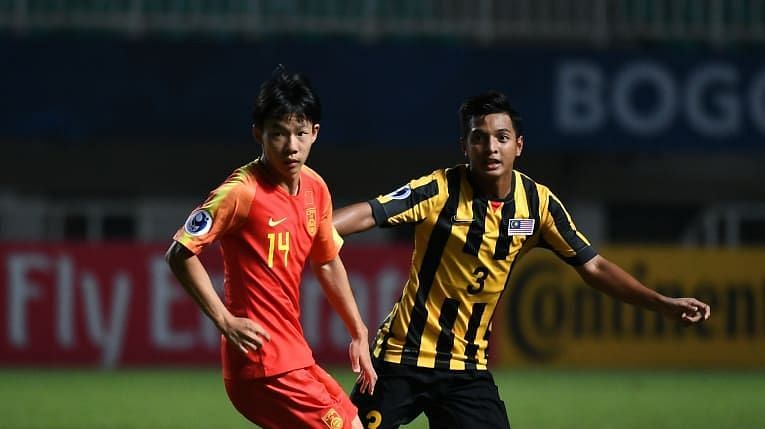 Yang Yilin of China (on the left) in action against Ahmad Tasnim Fitri of Malaysia (Image Courtesy: AFC)