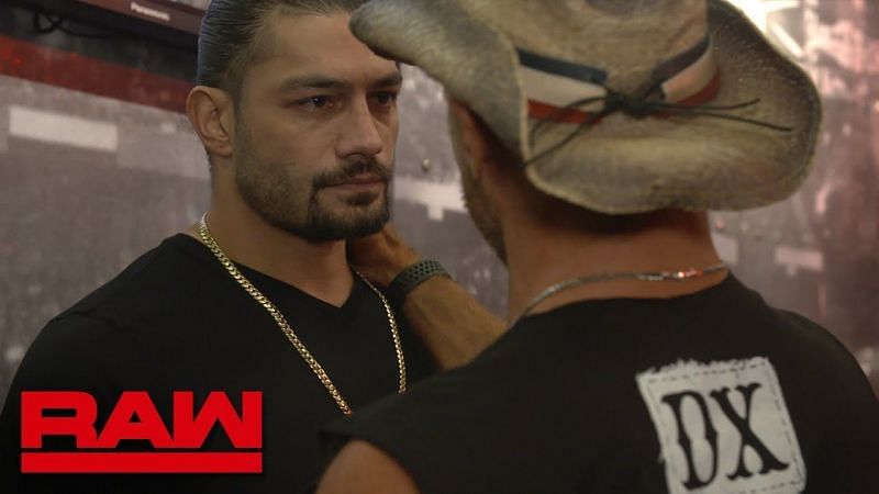 Former Universal Champion Roman Reigns is consoled by Shawn Michaels.