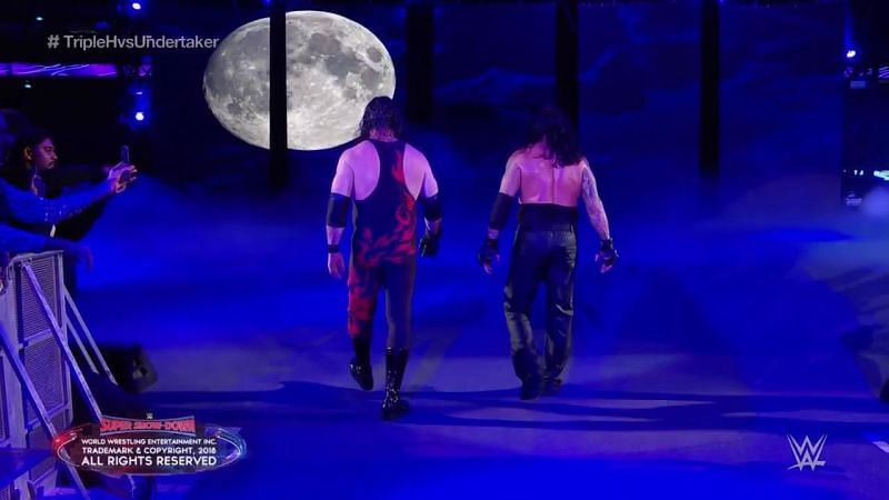 Kane and Undertaker walk away from the carnage